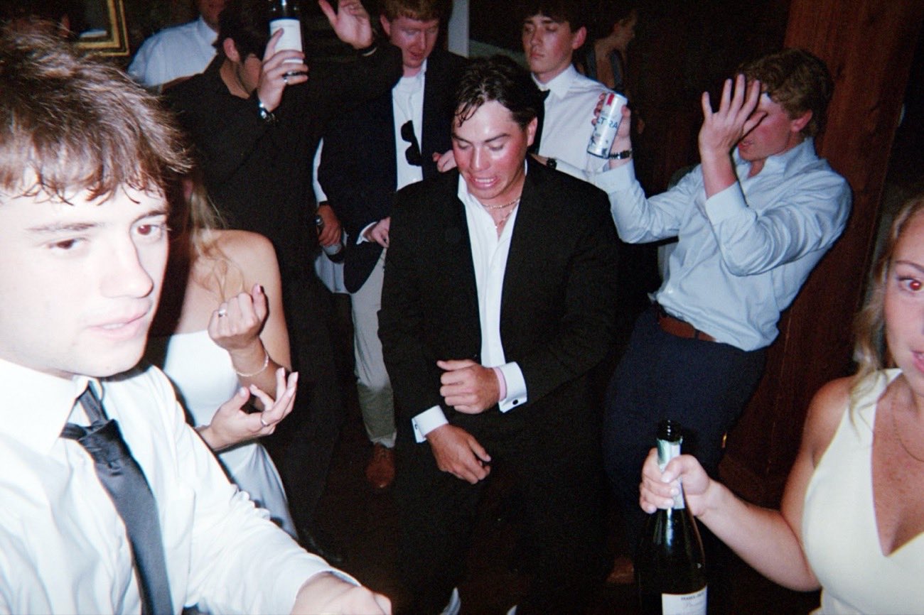 Wedding guests dancing and laughing together