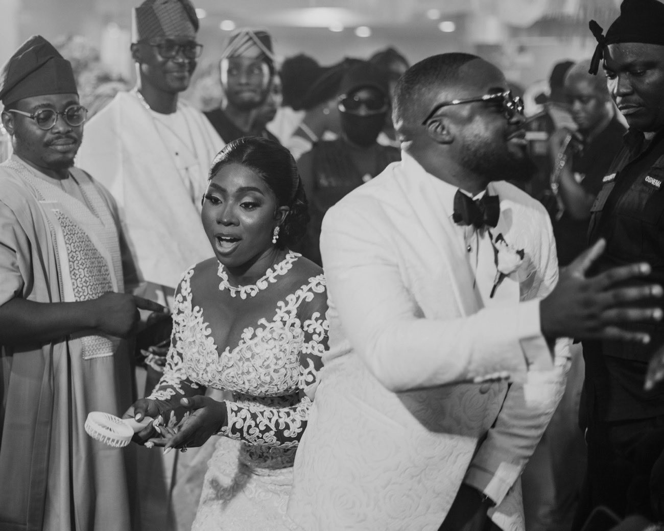 Bride and groom celebrating at a traditional Nigerian wedding reception